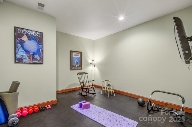 exercise area with recessed lighting, visible vents, and baseboards