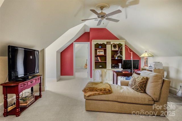 carpeted living room featuring a ceiling fan, vaulted ceiling, and baseboards