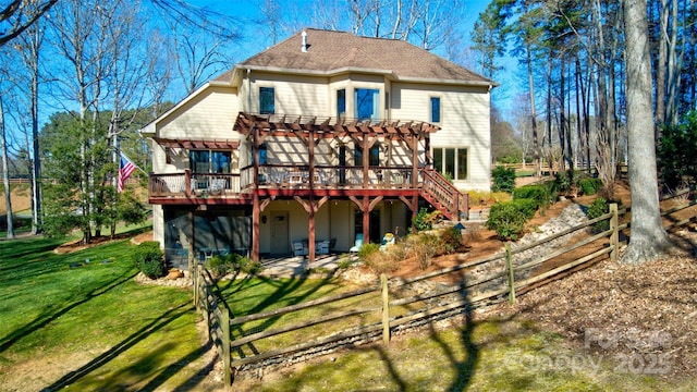 rear view of property with a deck, a lawn, fence, and a pergola