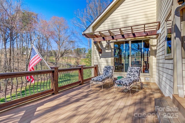 wooden terrace with a pergola