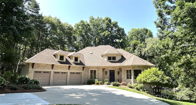 301 Agnew Rd, Mooresville, NC 28117 - view of front facade featuring stone siding, a garage, and concrete driveway