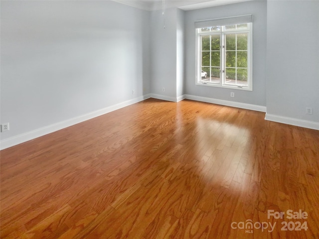 unfurnished room with light hardwood / wood-style flooring