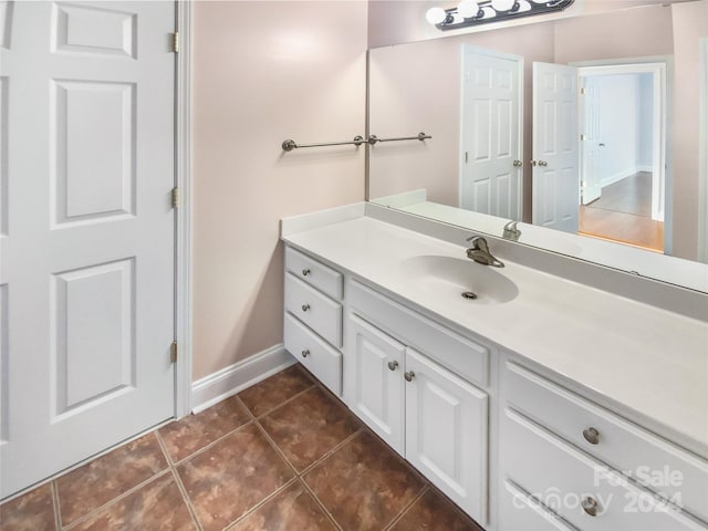 bathroom with vanity and tile patterned floors