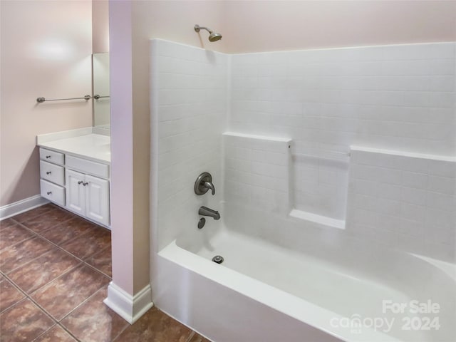 bathroom featuring vanity, tile patterned floors, and shower / bathtub combination