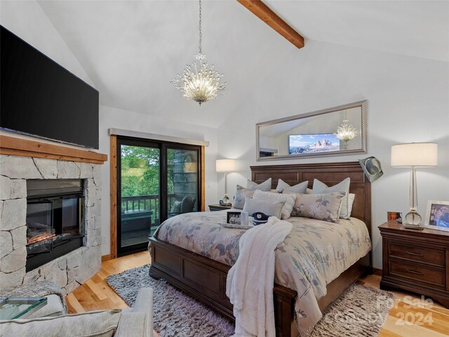 bedroom with vaulted ceiling with beams, light hardwood / wood-style flooring, a notable chandelier, and access to exterior