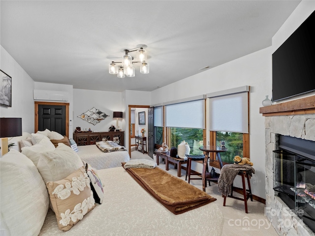 carpeted bedroom featuring a chandelier and a stone fireplace