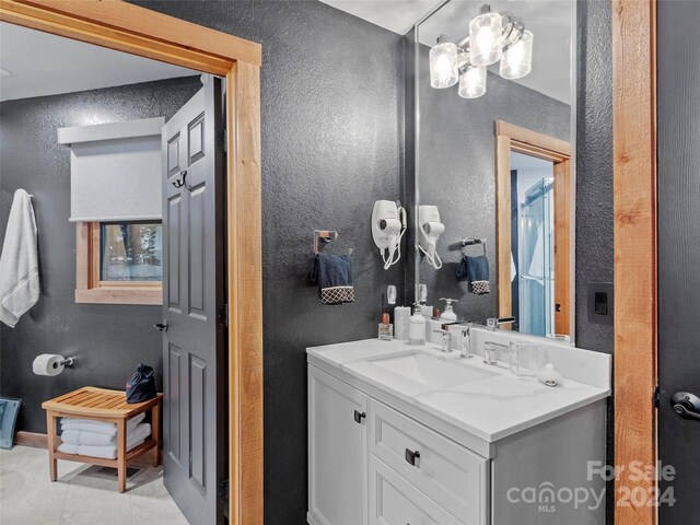 bathroom with vanity and tile patterned flooring