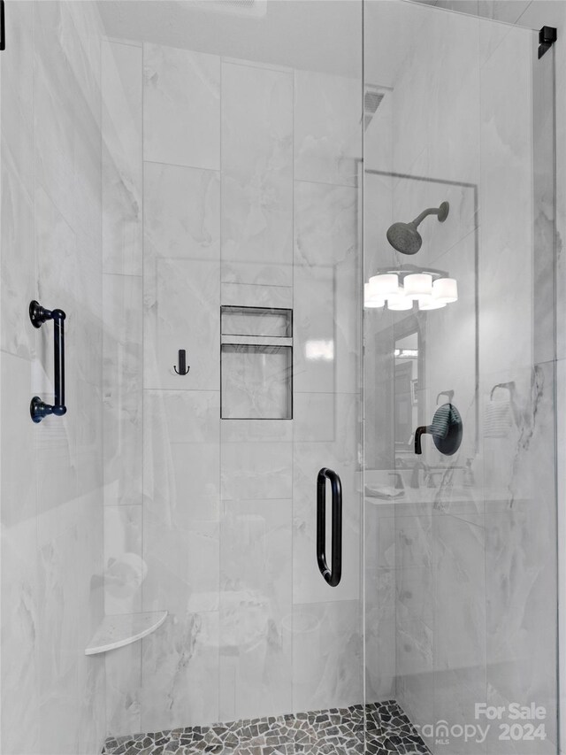 bathroom with an enclosed shower