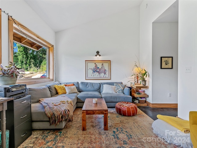 living room with high vaulted ceiling