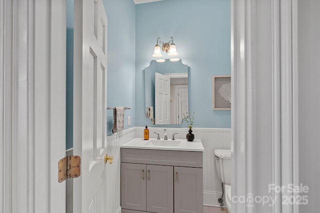 bathroom with vanity and toilet