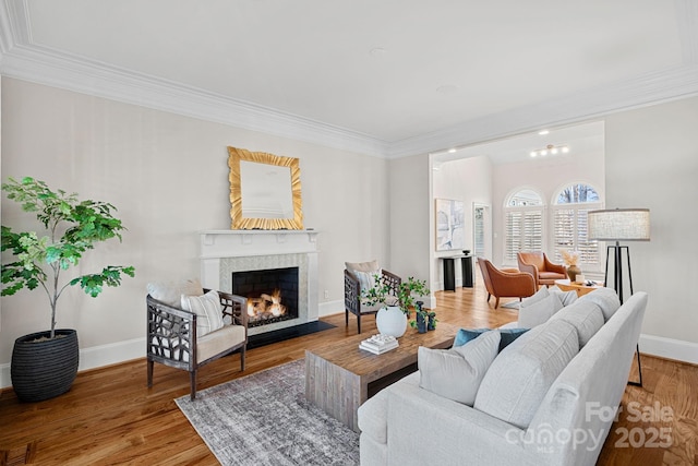 living room with hardwood / wood-style flooring and ornamental molding