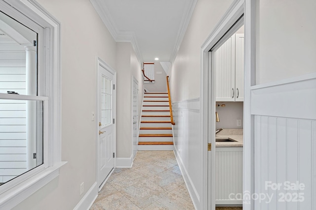 hallway with sink and crown molding