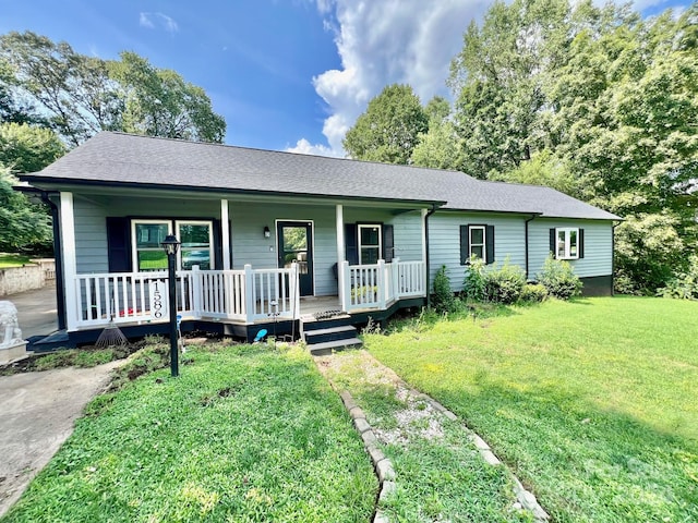 ranch-style home with a front lawn and a porch