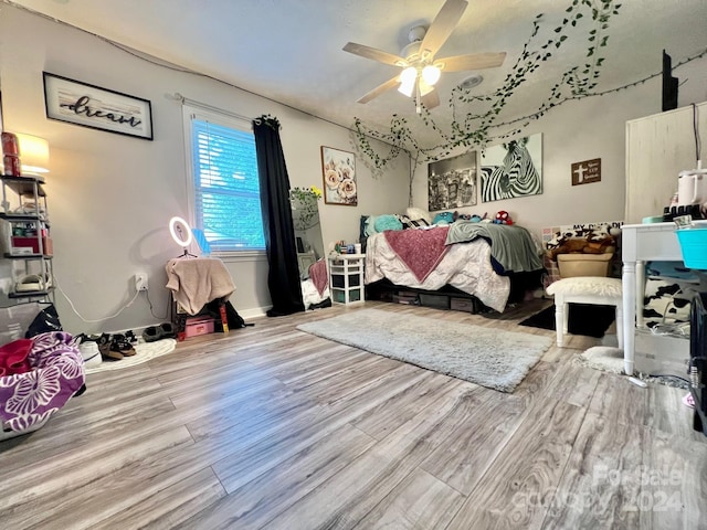 bedroom featuring ceiling fan and light wood-type flooring