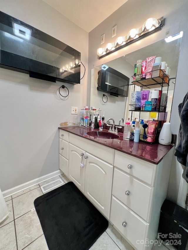 bathroom featuring vanity and tile patterned flooring