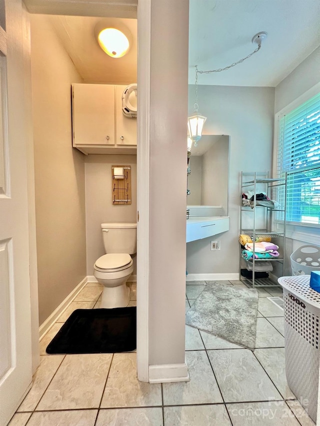 bathroom featuring tile patterned floors and toilet