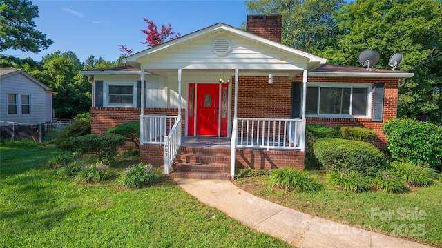 bungalow-style house with a front yard