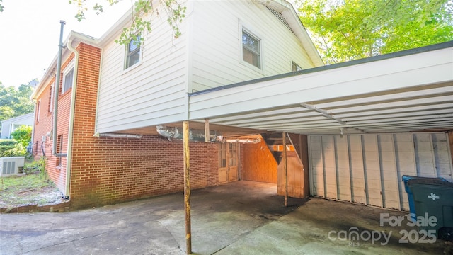 exterior space with a carport