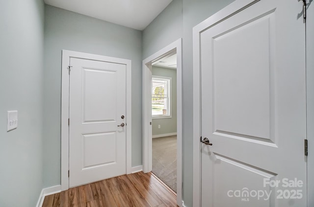 hall with light wood-type flooring