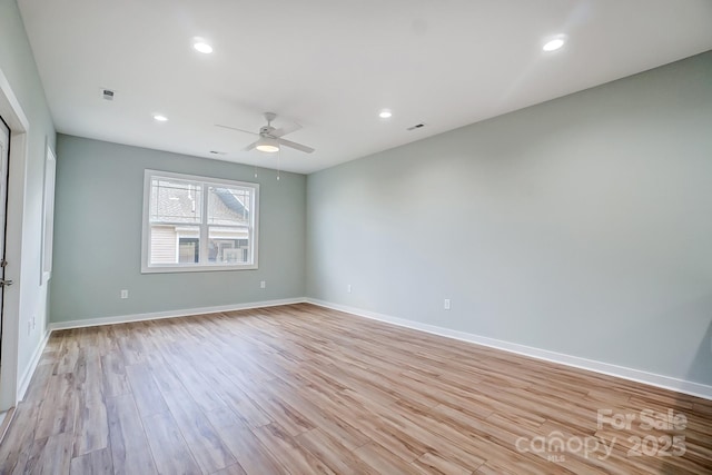 empty room with light hardwood / wood-style floors and ceiling fan