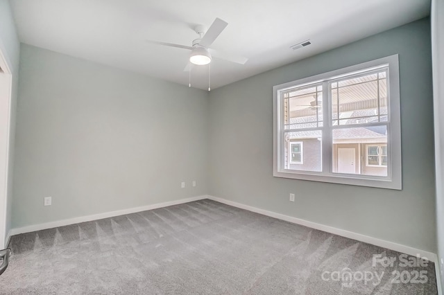 unfurnished room with light carpet and ceiling fan