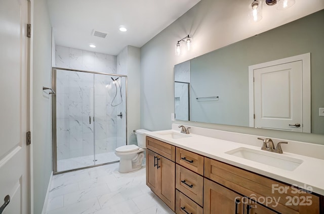 bathroom with a shower with door, toilet, and vanity