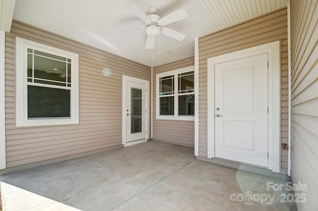 view of exterior entry featuring ceiling fan