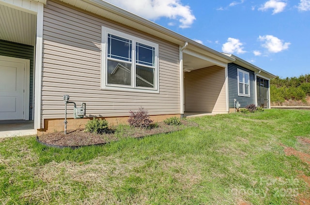 view of property exterior with a yard