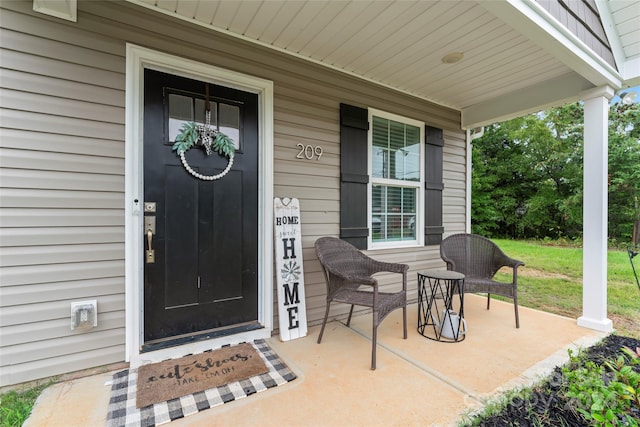 property entrance with covered porch