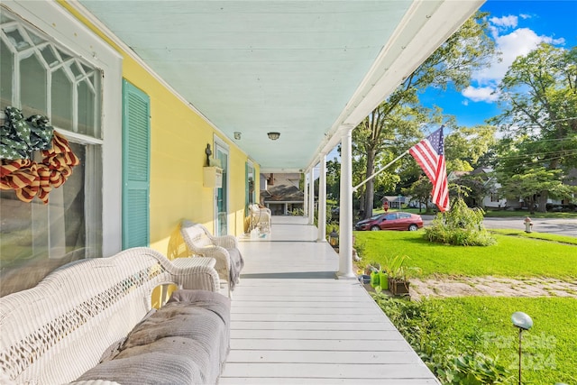 wooden terrace with a yard