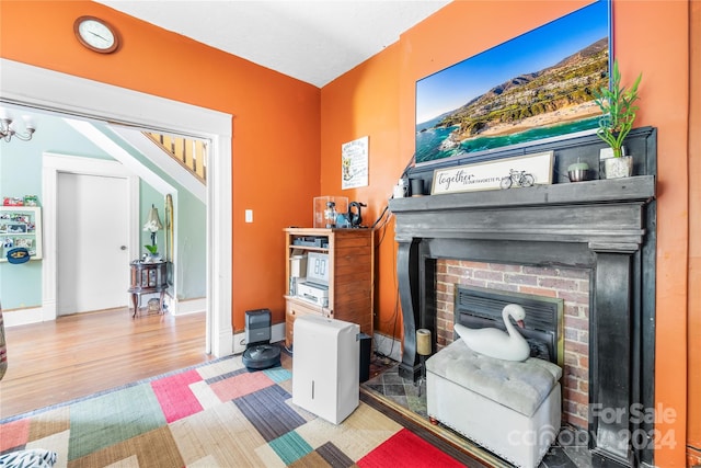 living room with a fireplace and hardwood / wood-style floors