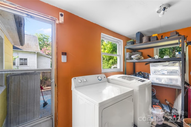 washroom featuring washing machine and clothes dryer