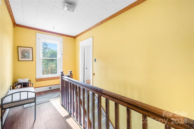 hall with crown molding and hardwood / wood-style floors