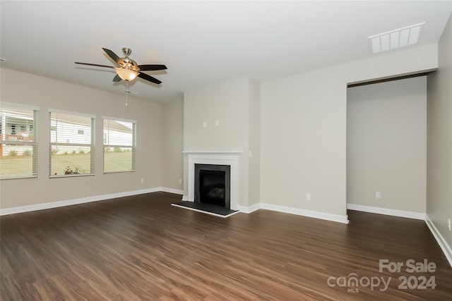 unfurnished living room with ceiling fan and hardwood / wood-style flooring