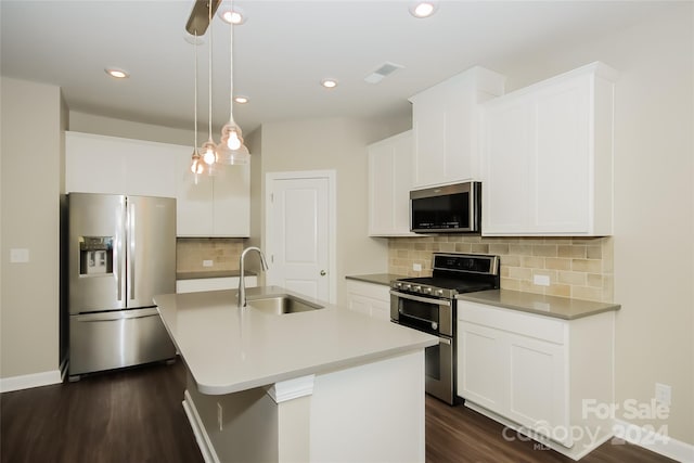 kitchen with decorative light fixtures, tasteful backsplash, sink, appliances with stainless steel finishes, and dark wood-type flooring