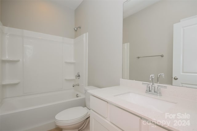 full bathroom with toilet, vanity, and tub / shower combination