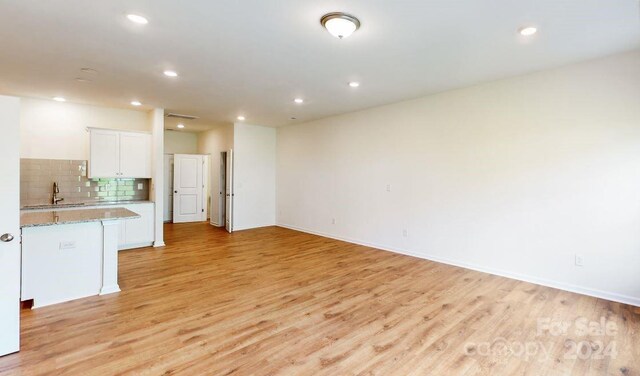 interior space featuring light hardwood / wood-style floors and sink