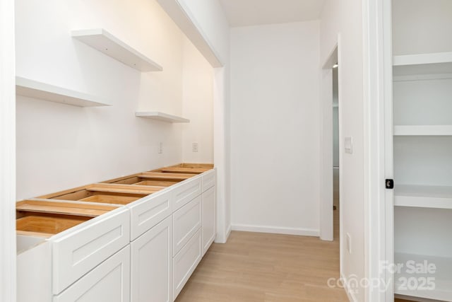 654 Hollybrook Dr, Flat Rock, NC 28731 - spacious closet featuring light wood finished floors