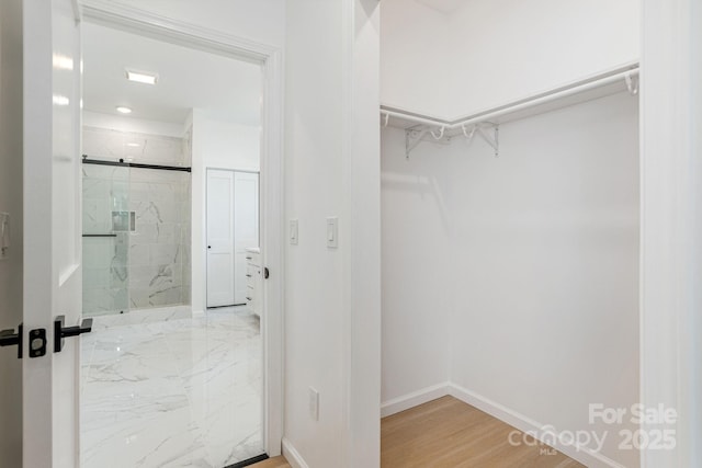 654 Hollybrook Dr, Flat Rock, NC 28731 - spacious closet featuring wood finished floors