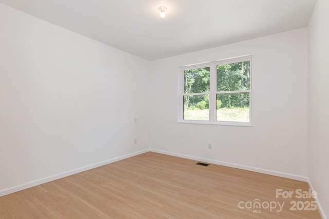 654 Hollybrook Dr, Flat Rock, NC 28731 - unfurnished room with light wood finished floors and baseboards