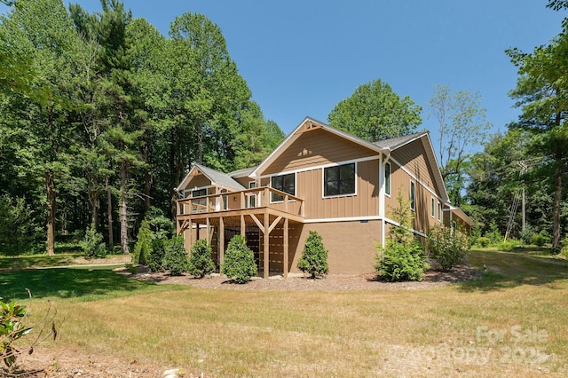 654 Hollybrook Dr, Flat Rock, NC 28731 - back of property with a yard and a deck