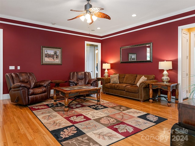 living room featuring light hardwood / wood-style flooring, crown molding, and ceiling fan