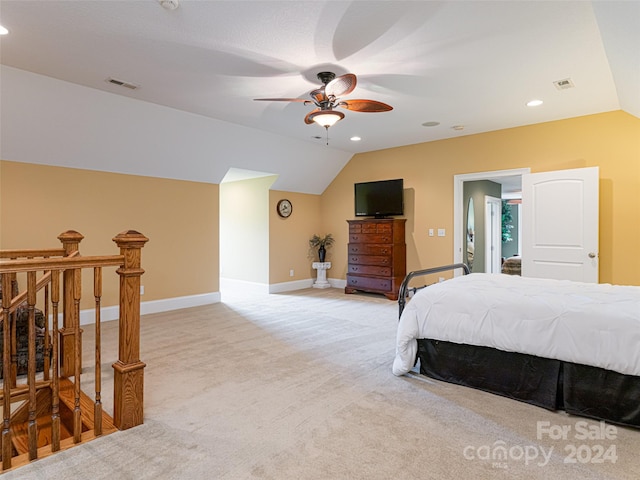 carpeted bedroom with ceiling fan and lofted ceiling