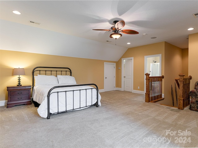 bedroom with light carpet, vaulted ceiling, and ceiling fan