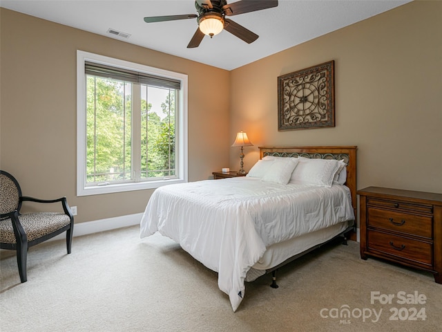 carpeted bedroom with ceiling fan