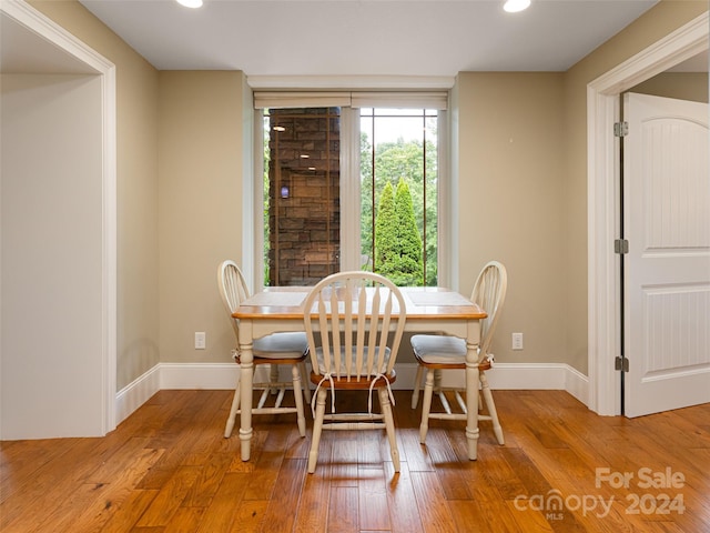 dining space featuring wood-type flooring