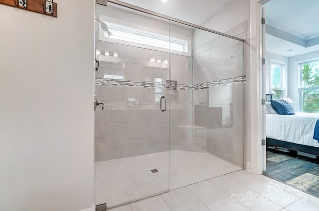 bathroom featuring walk in shower, tile patterned flooring, and ornamental molding