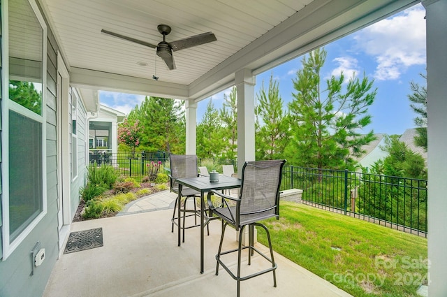 view of patio / terrace featuring ceiling fan