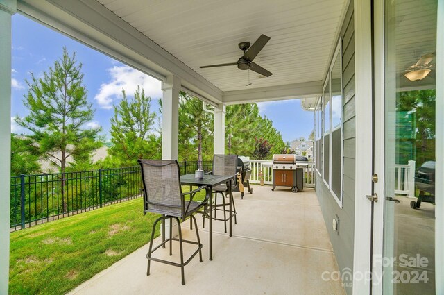 view of patio / terrace featuring ceiling fan and a grill