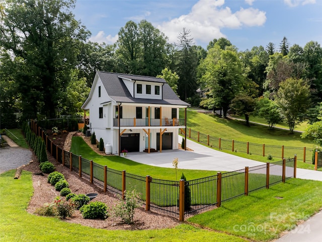 view of front of house with a garage and a front yard